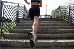 woman jogging up outdoor steps