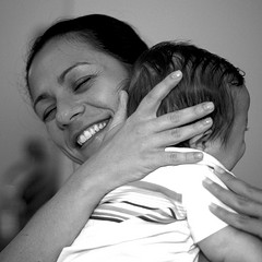 mom hugging toddler son