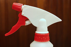 red and white utility spray bottle