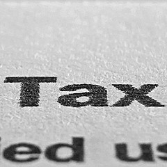 closeup of word tax printed on paper