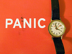 watch on red background next to the word PANIC