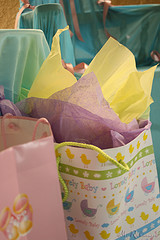 gift bag with purple and yellow tissue showing