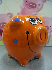 orange clay piggy bank with smile