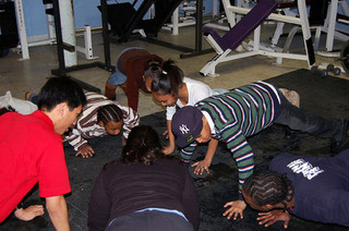 kids in schoolroom doing pushups