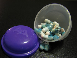 pills in plastic toy container