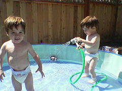 toddlers playing in kiddie pool