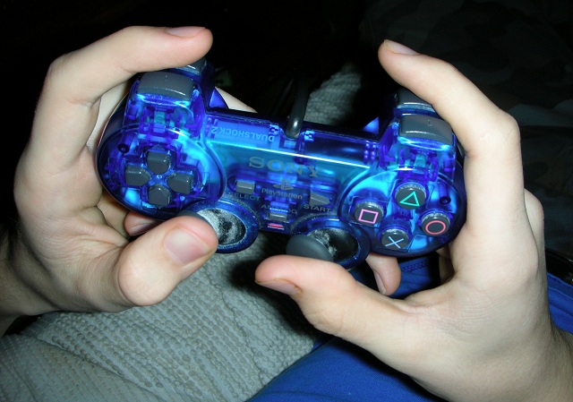 hands holding video game controller