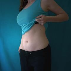 woman showing off flat belly