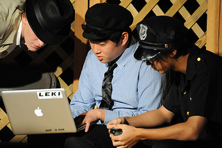 teen boys looking at laptop