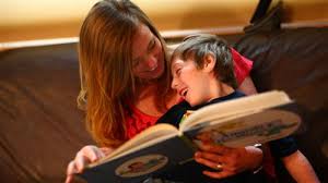 nanny reading story to little boy