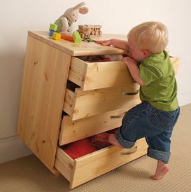 toddler climbing on tipping dresser