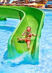 girl sliding down water slide
