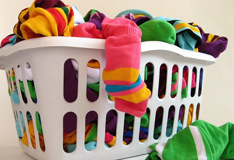 laundry basket full of colorful clothes
